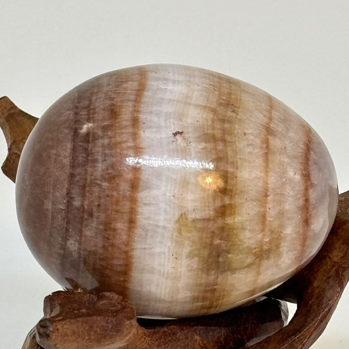 Vintage Polished Semiprecious Stone Egg on Hand-Carved Wooden Stand